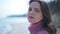 Headshot portrait of worried anxious Caucasian woman standing on river beach looking at camera. Close-up of troubled