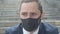 Headshot of sad depressed man in Covid-19 face mask. Close-up portrait of frustrated desperate Caucasian businessman