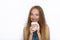 Headshot of young adorable playful blonde woman with cute smile in cobalt color blouse posing with big pure white mug on white bac