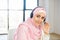 Headshot of young Muslim Arab woman in headset