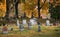 Headstone in a fall graveyard