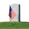 Headstone and small American flag on green grass isolated