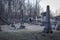 Headstones at an old delapidated looking graveyard on a gray gloomy day in Upstate New York