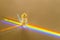 Healing chakra crystal and rainbow on beige background. Meditation, reiki and spiritual healing concept