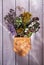 Healing herbs and flowers for herbal tea on a wooden background in a birch bark box