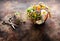 Healing herbs and flowers in a wooden bowl for making herbal tea and scissors