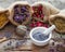 Healing herbs in hessian bags and mortar of lavender