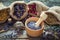 Healing herbs in hessian bags, wooden mortar with dry lavender
