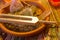 Healing tuning fork and crystal stone on table .