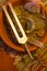 Healing tuning fork and crystal stone on table .