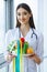 Health and Beauty. Serious Doctor Writes Plane Diet. Woman Sits At The Office. Young Doctor with Beautiful Smile and