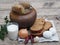 Health benefits of boiled potatoes, potatoes in the skin in a clay pot on a natural wooden background with natural simple picnic