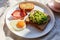 health breakfast, bacon and egg, toast and avocado