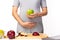 Health care concept. Pregnant mother hold green apple or fruit for eating. It is healthy food for fetus, pregnant woman. Mom care
