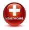 Health care (plus sign) glassy brown round button