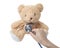 Health care teddy bear heart stethoscope isolated on white background,