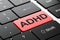 Health concept: ADHD on computer keyboard background