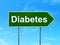 Health concept: Diabetes on road sign background