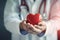 health concept person doctor hand care cardiology medicine hospital heart. Generative AI.