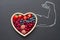 Health diet heart abstract concept with strongman hand on blackboard
