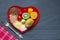 Health food on a red heart plate diets abstract still life