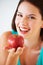 Health, happy and portrait of woman with apple for nutrition, wellness and snack in studio. Food, balance diet and face