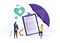 Health insurance concept. Big clipboard with document on it under the umbrella. Healthcare, finance and medical service