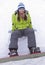 A health lifestyle image of young snowboarder