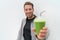 Health man drinking weight loss green smoothie. Healthy fit man happy drinking detox cleanse vegetable juice. Active