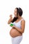 Health. Pregnant woman eating yogurt.