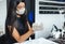 Health protection beauty care and opening of a modern salon after lockdown. Asian woman in protective mask in rubber