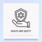 Health and safety thin line icon: hand holding shield with medical symbol. Modern vector illustration