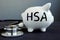 Health Savings Account HAS written on a piggy bank.