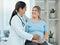 Healthcare, comfort and doctor with a pregnant woman in a clinic touching her belly for support. Maternity, wellness and