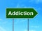 Healthcare concept: Addiction on road sign background