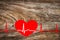 healthcare and medicine concept - close up of red heart with ecg line on wooden background. Happy Valentine day. Hand drawing ECG