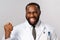 Healthcare, medicine and hospital treatment concept. Close-up portrait of triumphing, rejoicing african-american doctor