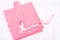 Healthcare and medicine symbol - pink breast cancer awareness ribbon on female shirt