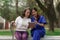 Healthcare nurse, physical therapy with elderly woman at outdoor. Nurse holding hand and help elderly woman