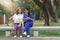 Healthcare nurse, physical therapy with elderly woman at outdoor. Nurse using tablet with elderly woman