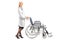 Healthcare professional pushing a wheelchair