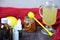 Healthcare, traditional medicine and flu concept - tea cup with lemon, ginger, honey and pills on wooden table. tablets