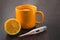 Healthcare, traditional medicine and flu concept - tea cup with lemon and pills. Medical pills and hot tea with lemon