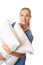 Healthcare worker carrying patient pillows