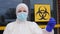 Healthcare worker showing biohazard sign
