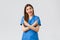 Healthcare workers, prevent virus, insurance and medicine concept. Enthusiastic smiling female nurse, doctor in blue