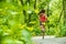 Healthy active lifestyle woman runner jogging in forest path sport athlete training outdoor in green nature. Fit person working