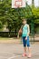 Healthy active teenage girl on a basketball court