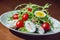 Healthy appetizing tuna salad with arugula leaves and scrambled eggs