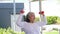 Healthy Asian elderly woman exercising exertion lifting dumbbells happy